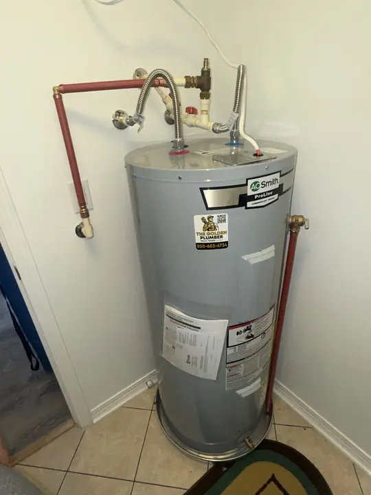 New A. O. Smith ProLine electric water heater with drain pan and new supply connections