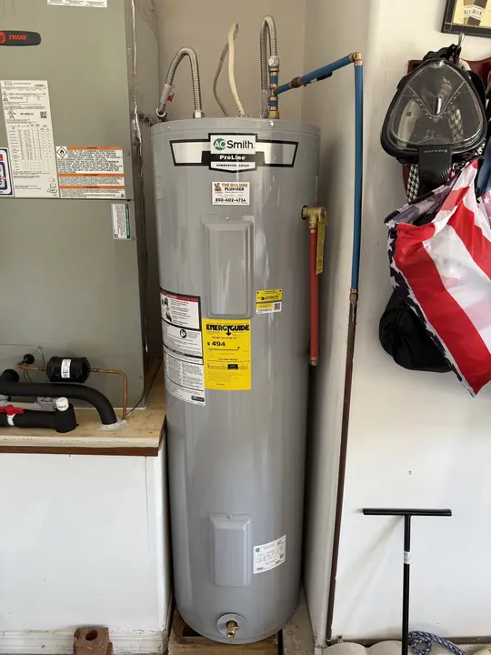 New tall A. O. Smith ProLine electric water heater with blue PEX supply line
